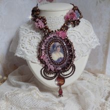 Belle Romance Haute-Couture necklace embroidered with a cabochon portrait of a woman in a hat with crystals, satin pearls, golden round pearls, mother of pearl cabochons and 